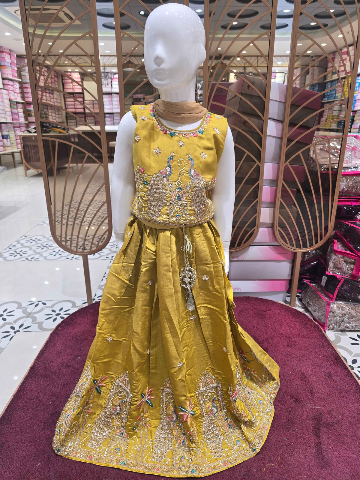 Chinon material yellow colour ethnic wear. beats & sequence work on peacock designed top and thread work on round neck, with ladkans