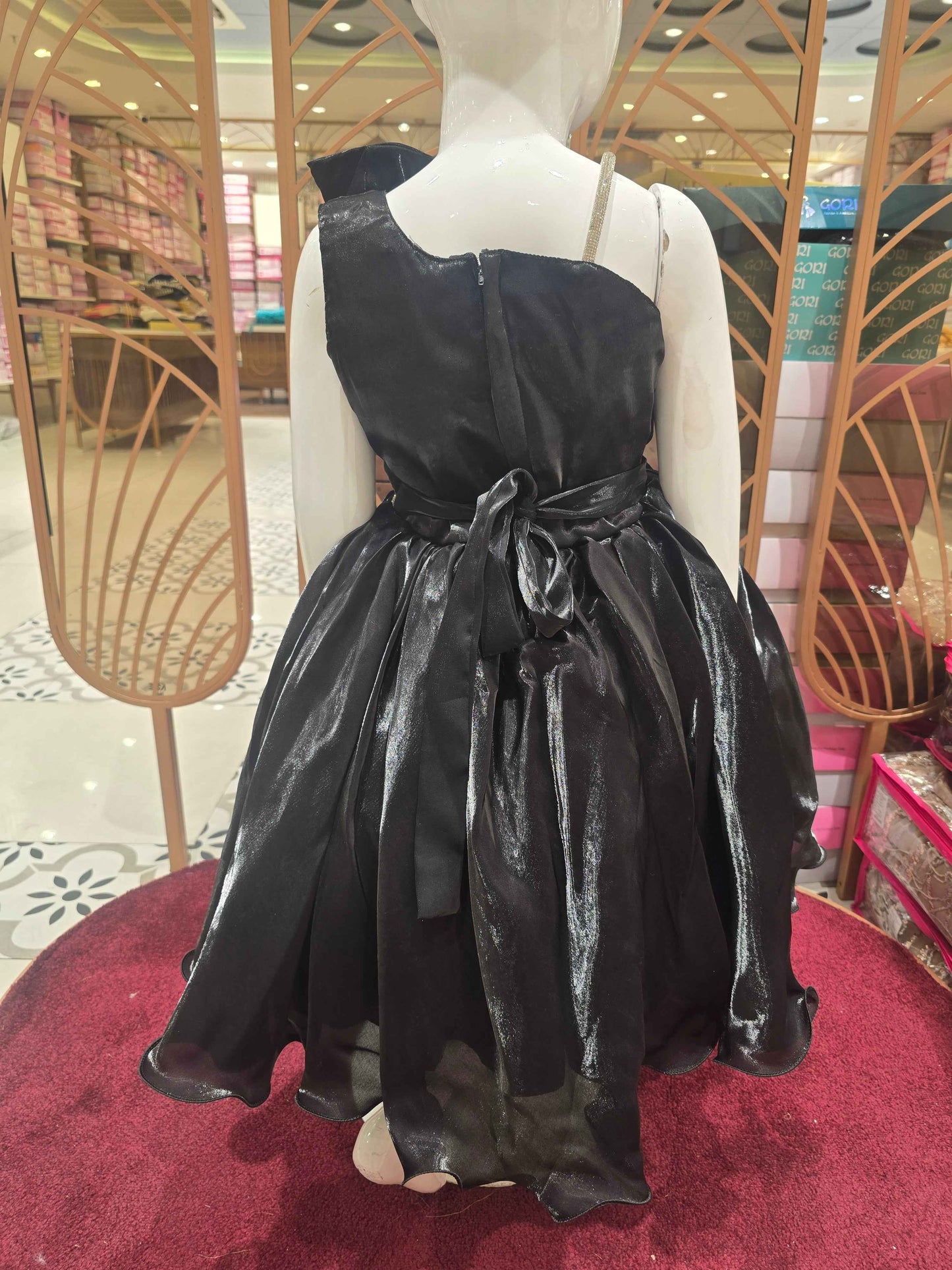 Satin material black coloured party wear frock with speghetti on right side and bow on left
