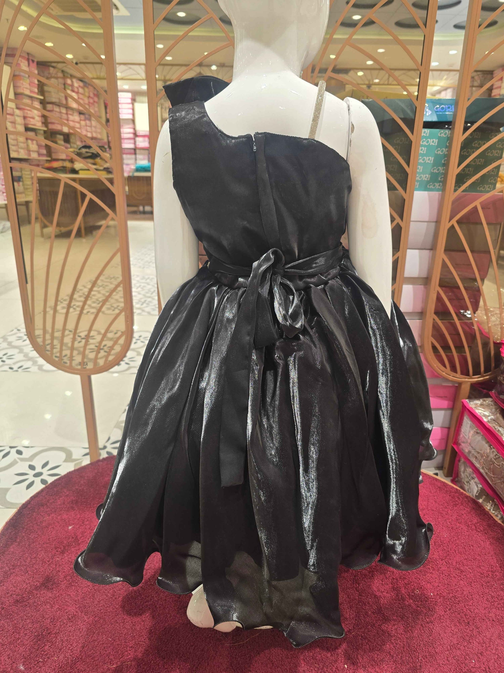 Satin material black coloured party wear frock with speghetti on right side and bow on left