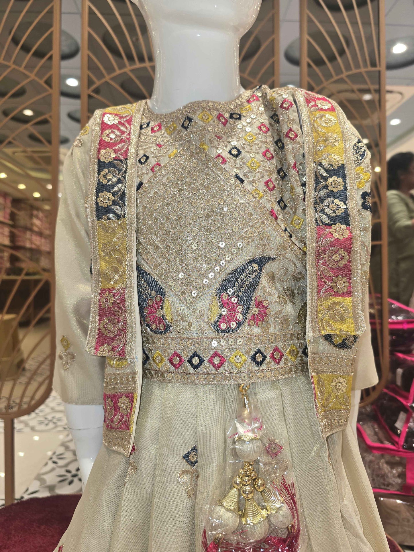 Shimmer material cream colour ethnic wear gaghra with multi colour embroidery, sequence & thread work with ladkans and jacket