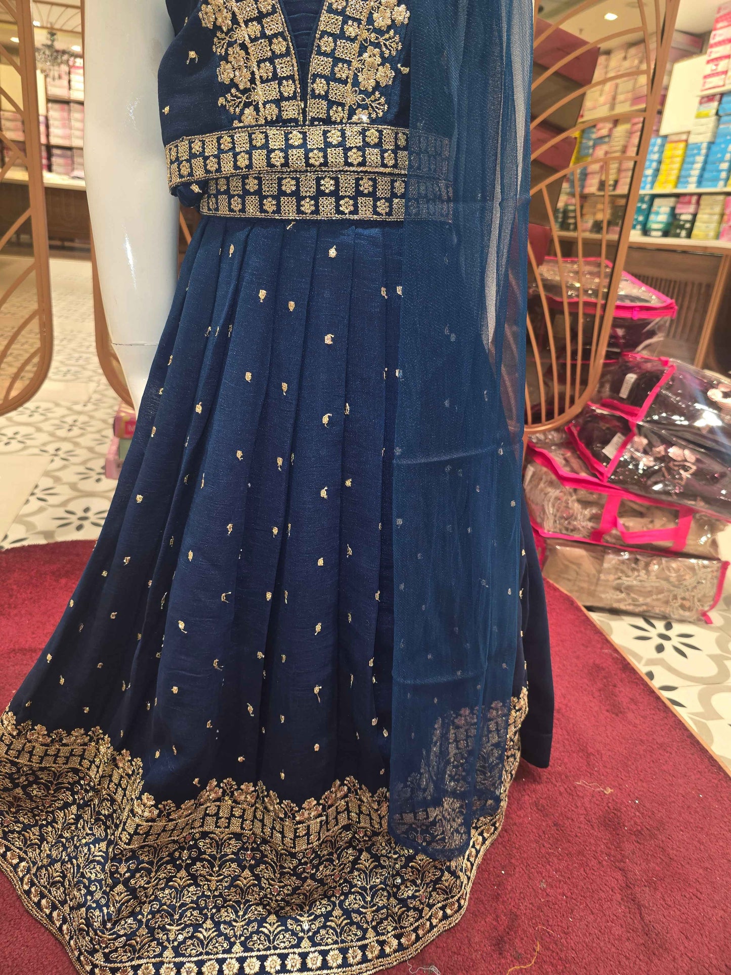 Chinon material Teel blue colour gaghra choli with zari embroidery on v styled neck. Small zari buta and traditional border