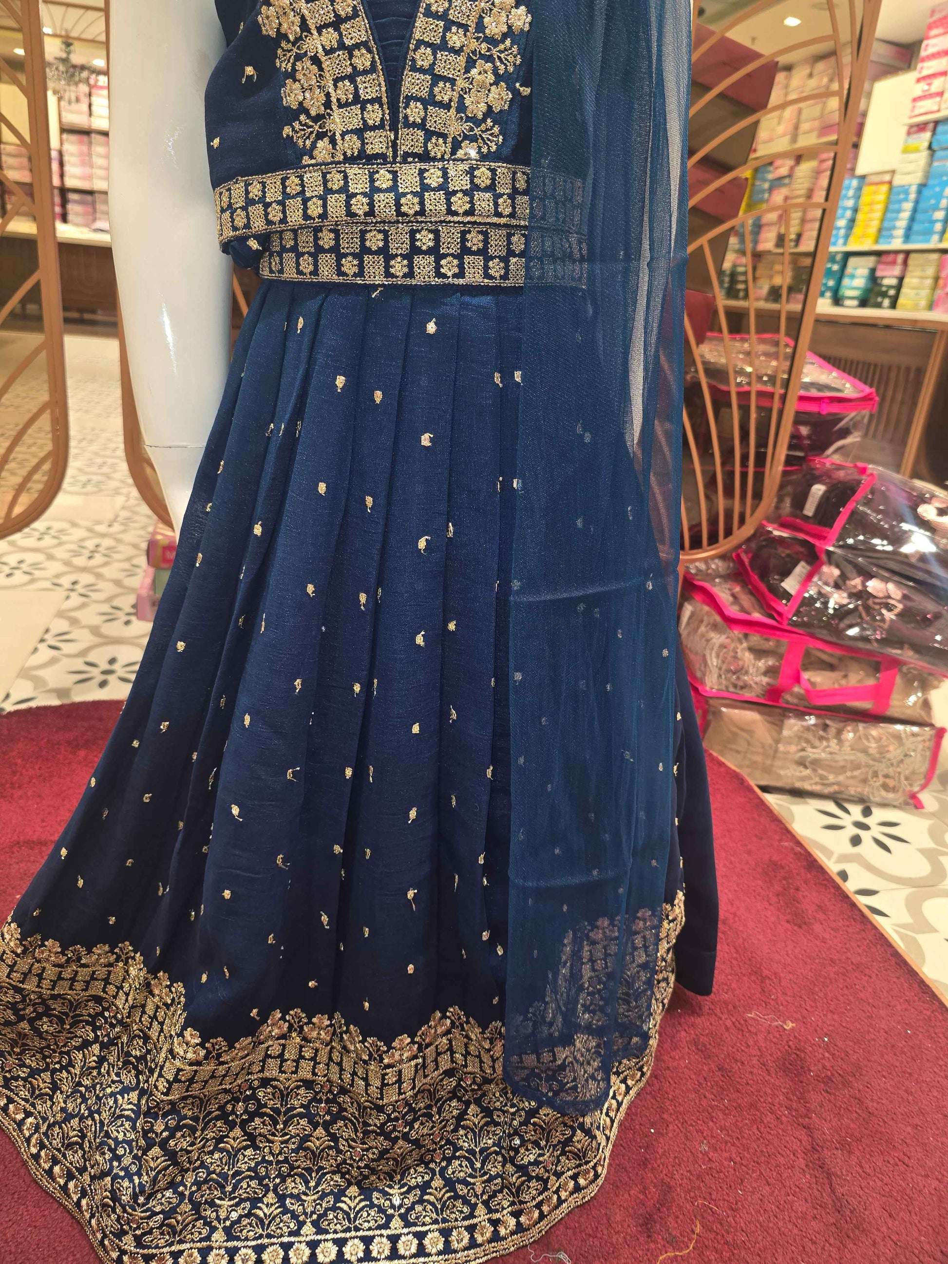 Chinon material Teel blue colour gaghra choli with zari embroidery on v styled neck. Small zari buta and traditional border