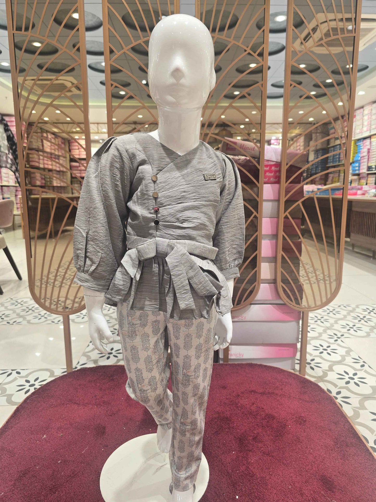 Span (stretchable) Material grey with printed white colour westren wear. The designer top has balloon sleeve and attachable tieing