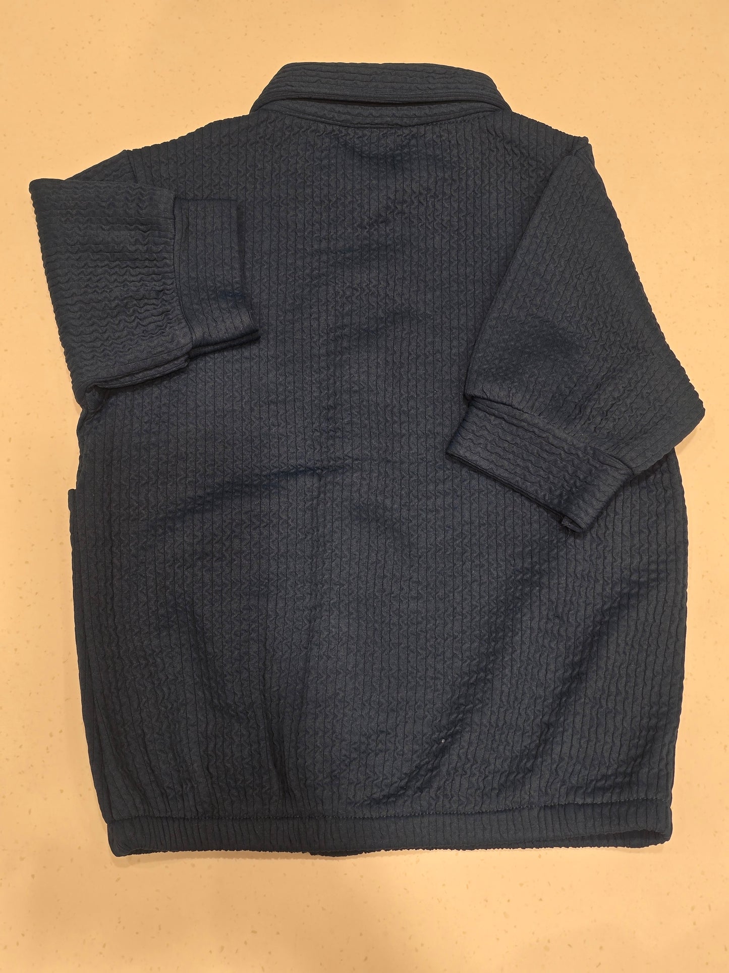 dark blue, smocked or waffle-textured kids' casual shirt