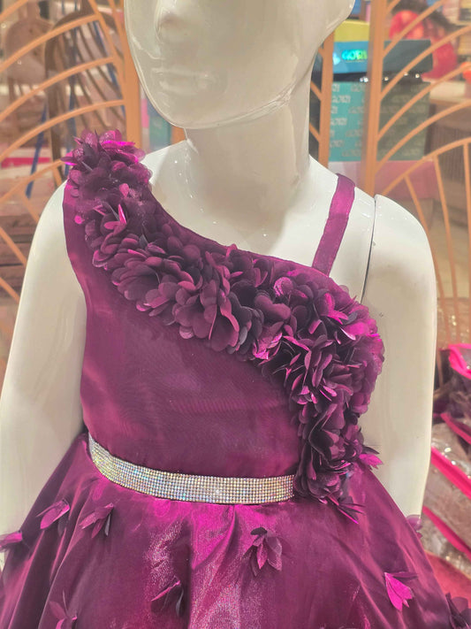 Organza material purple colour frock with flower cut design on border and bottom skirt left shoulder had speghetti with floral cut