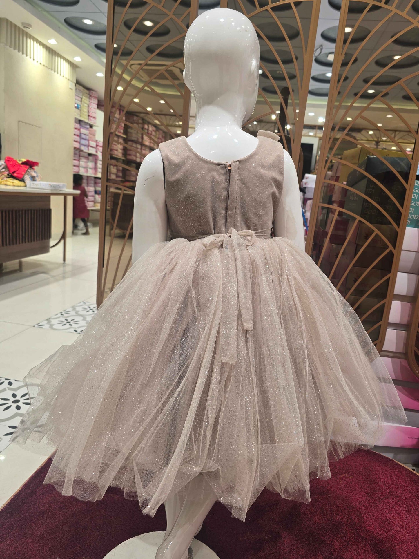 Shimmer Knitted material fawn colour party wear frock with two bow round neck