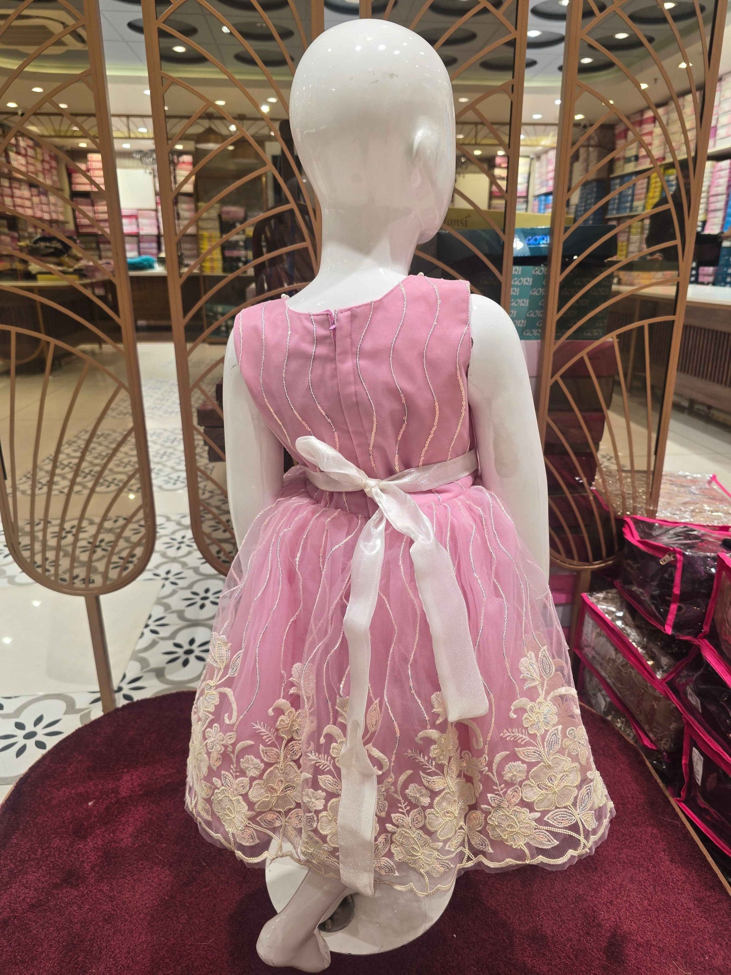 Knitted material baby pink coloured frock with elegant contrast white bow , embroidery with beats & sequence work over the body