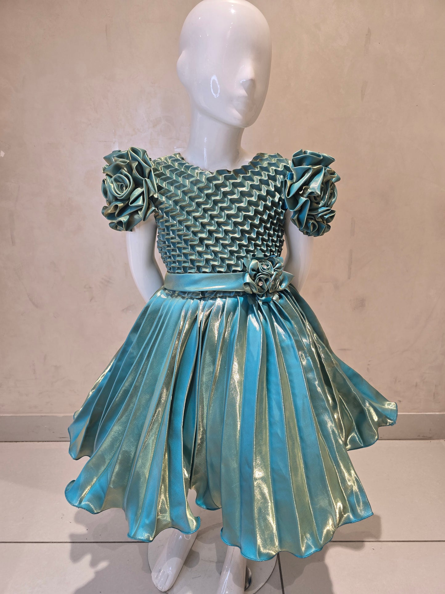 Shining Satin material green colored short frock with cold buff Sleeves , attached waist flower design