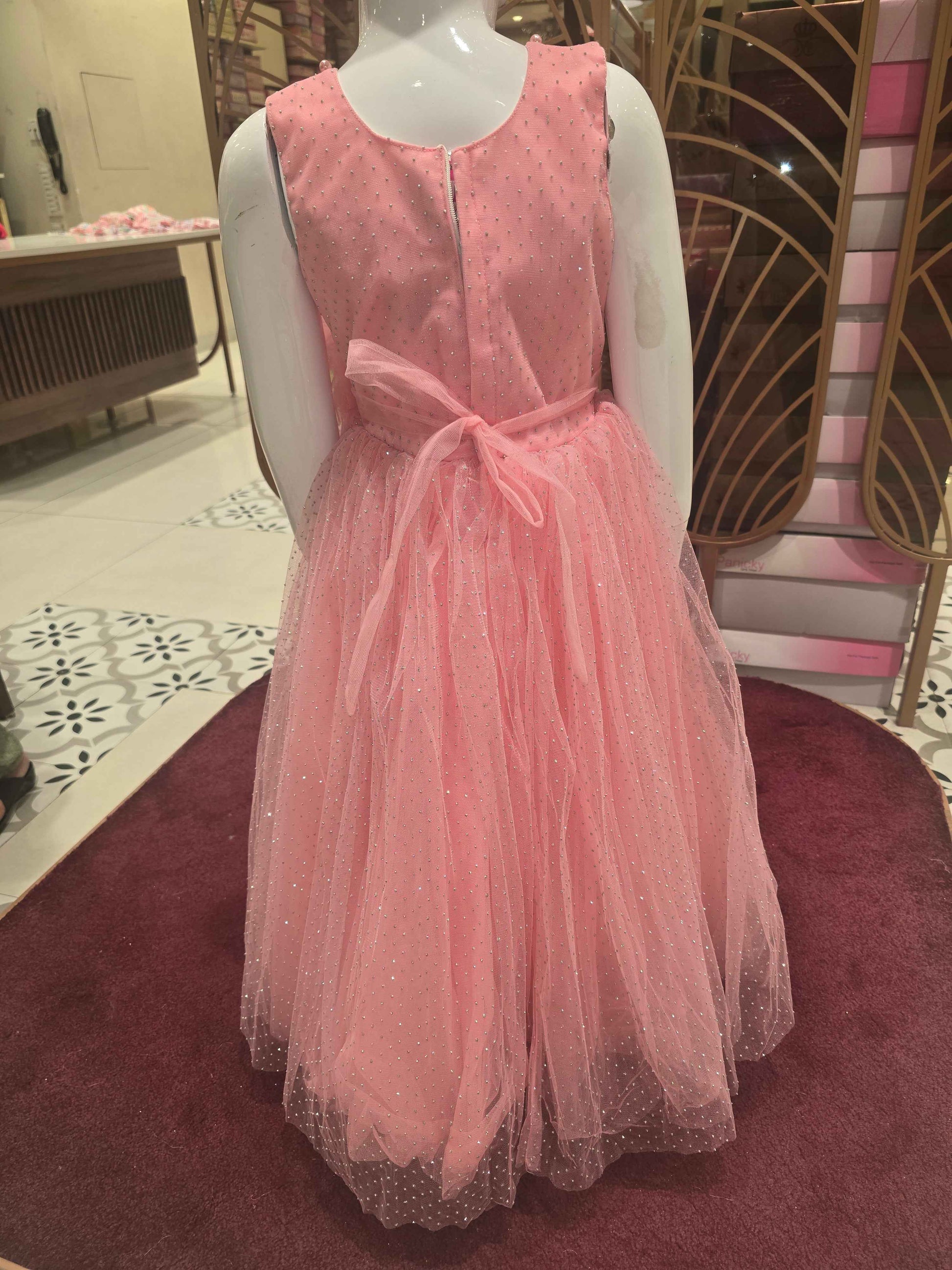 Doted Glitter Knitted material peach coloured bushi gowns with beats work on neck and flower design on waist