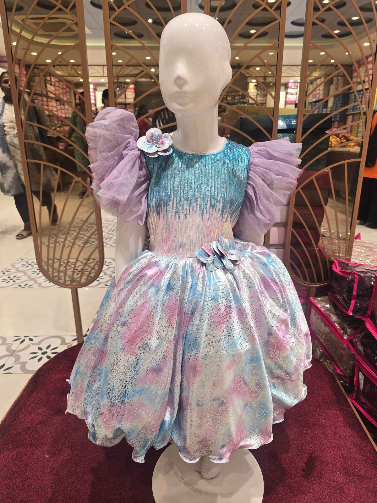 Shinning Satin material printed tale cut frock with dual colour sequence work over the top and buff Sleeves