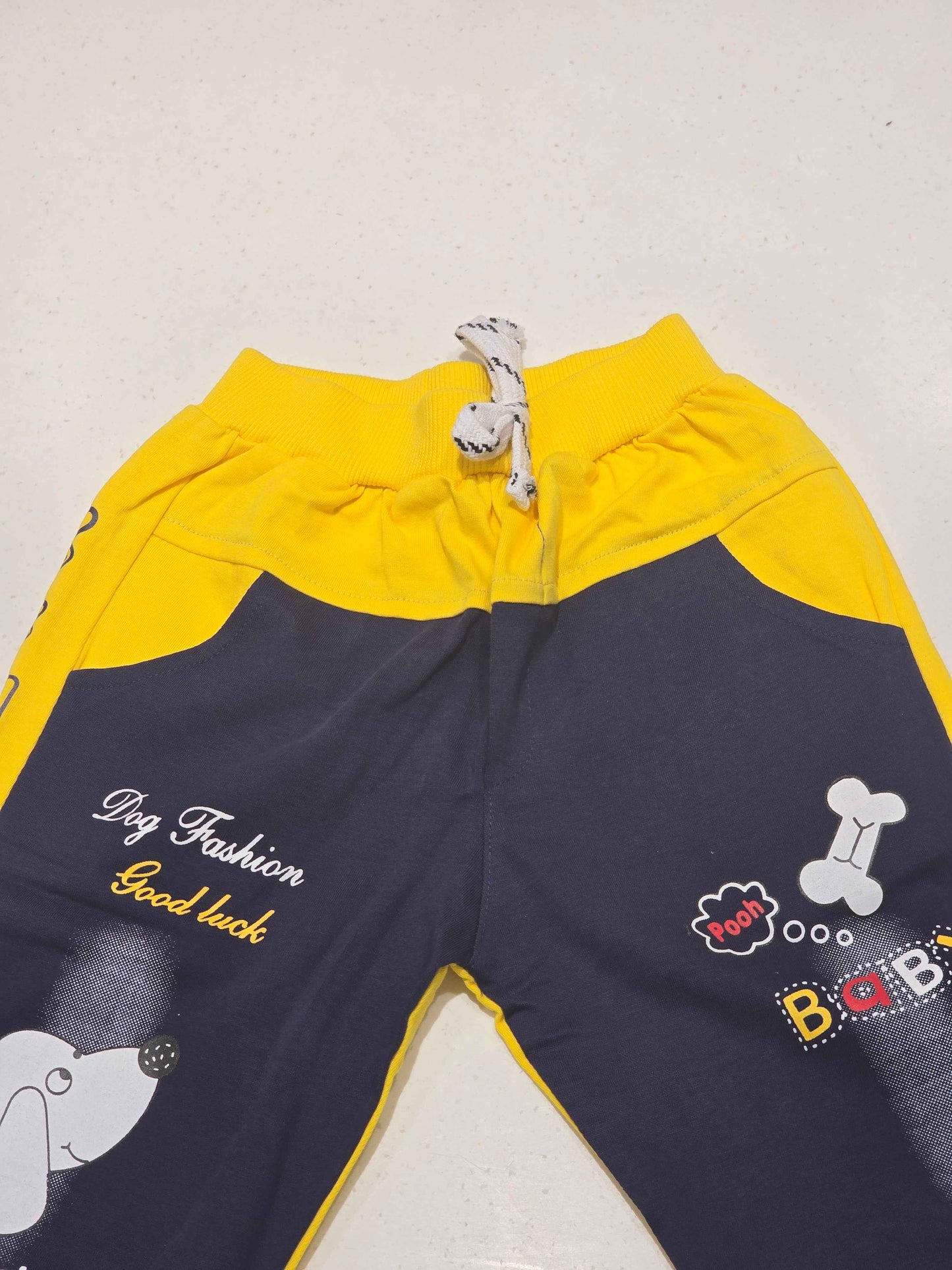 Cotton material yellow with blue color ¾ shorts with rubber prints