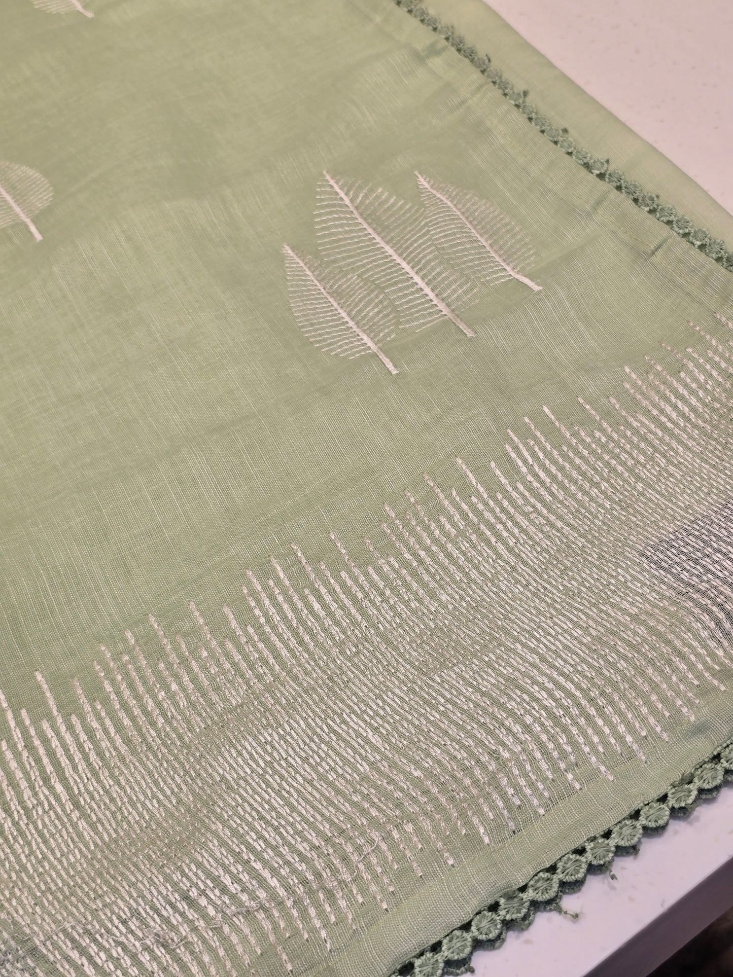 Linen with embroidery border and leaf motif Normal wear