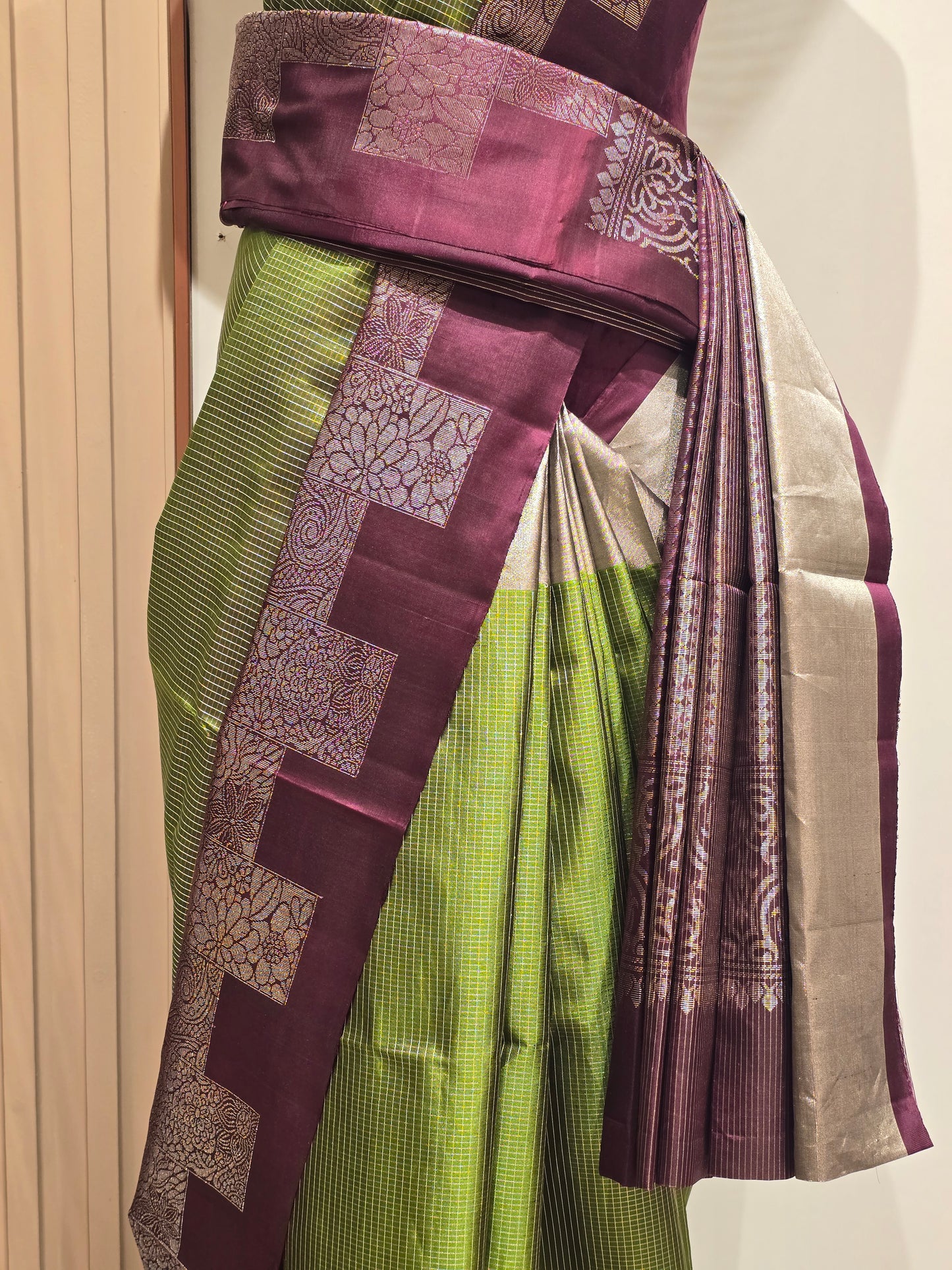 South Indian Kanchipuram silk saree styled with a distinctive modern grid-patterned layout border