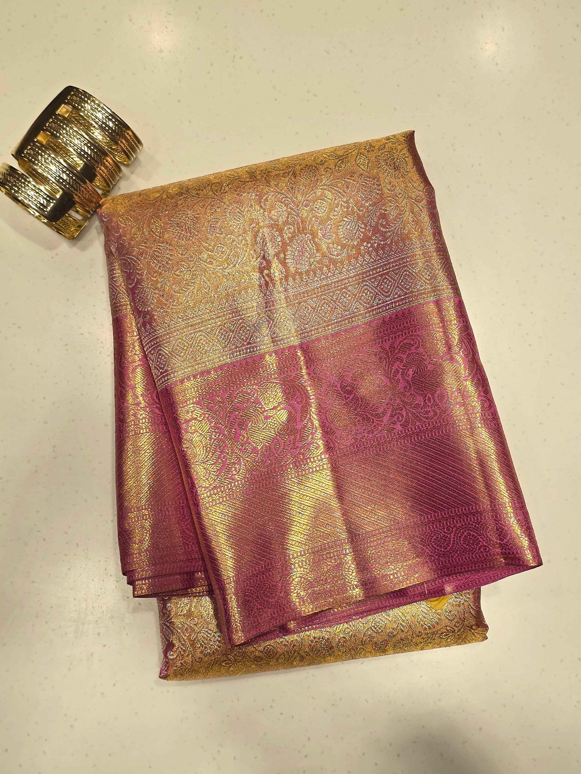 Pure handloom kanjivaram tissue silk baby pink base saree with contrast blouse and rich pallu , long traditional gatti border