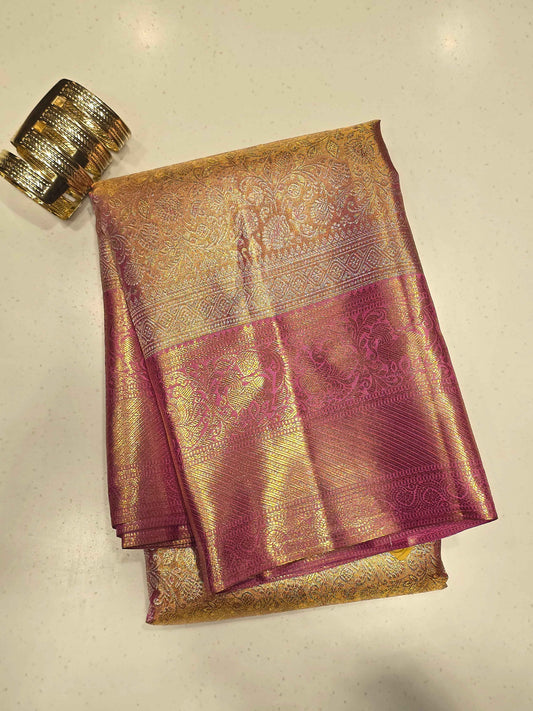 Pure handloom kanjivaram tissue silk baby pink base saree with contrast blouse and rich pallu , long traditional gatti border