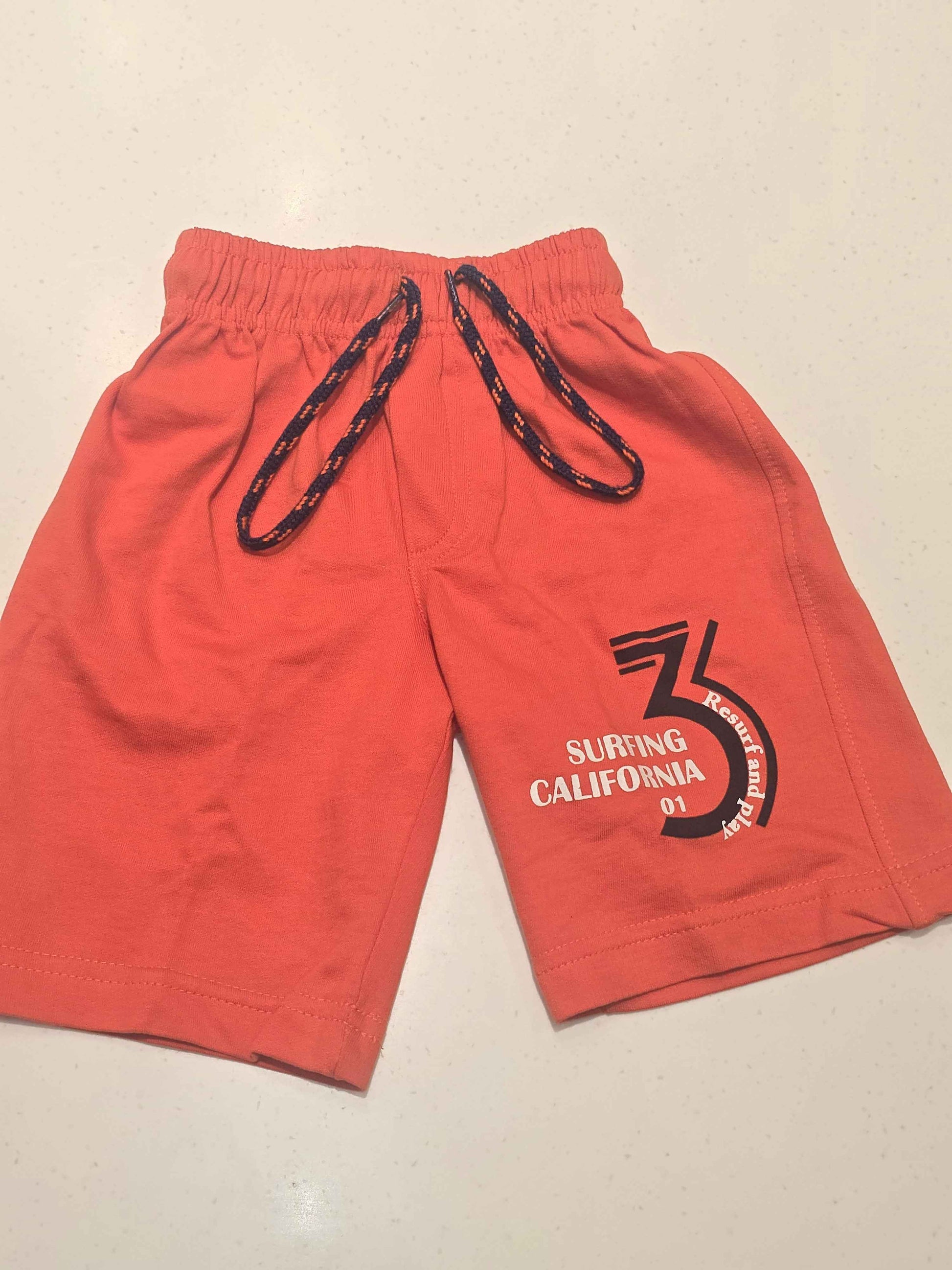 Pure cotton material orange coloured ¾ with prints and round Elasticable