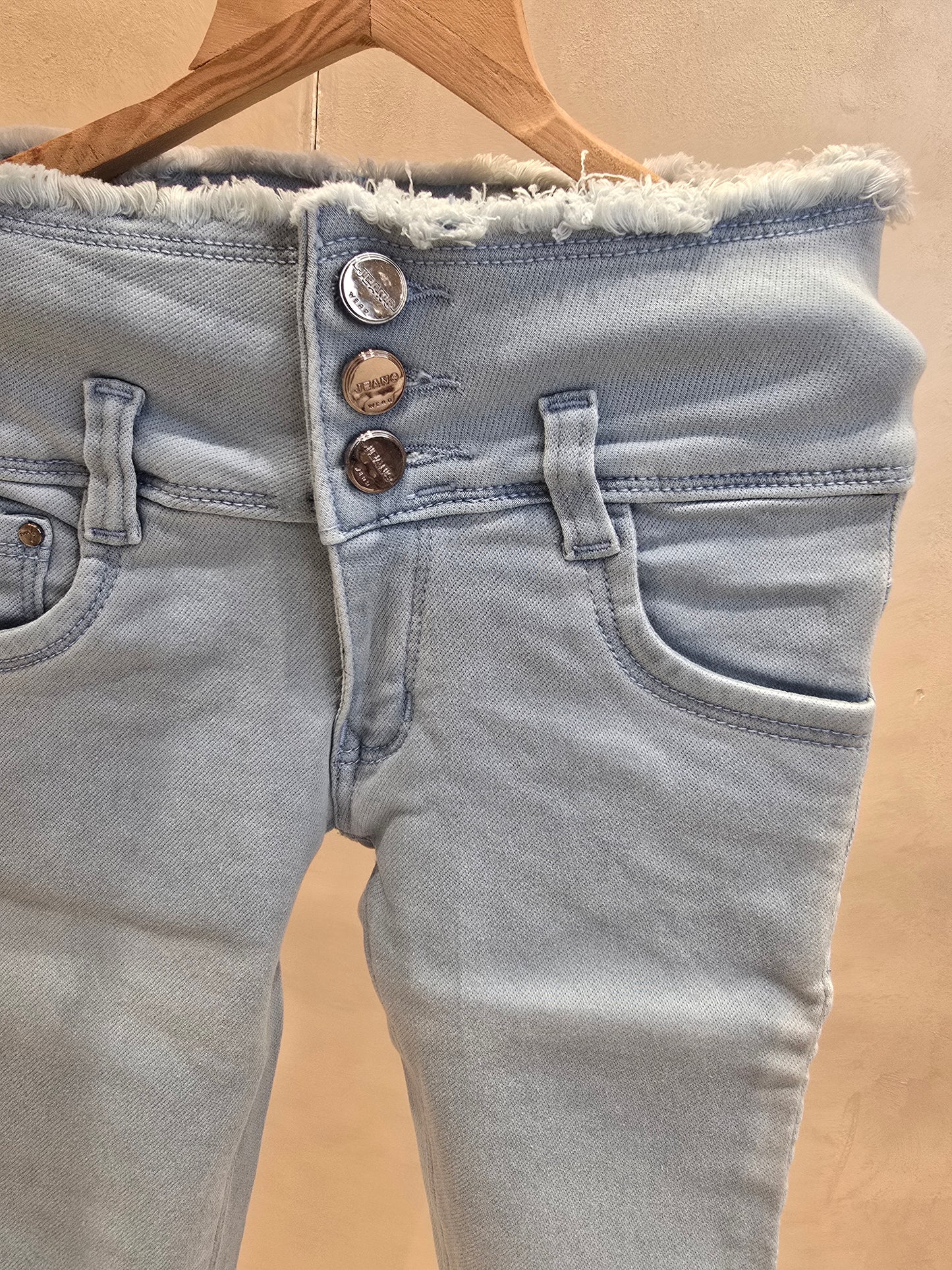 Sky blue colored denim jeans capri pant with 3 button and waist thread-cut design