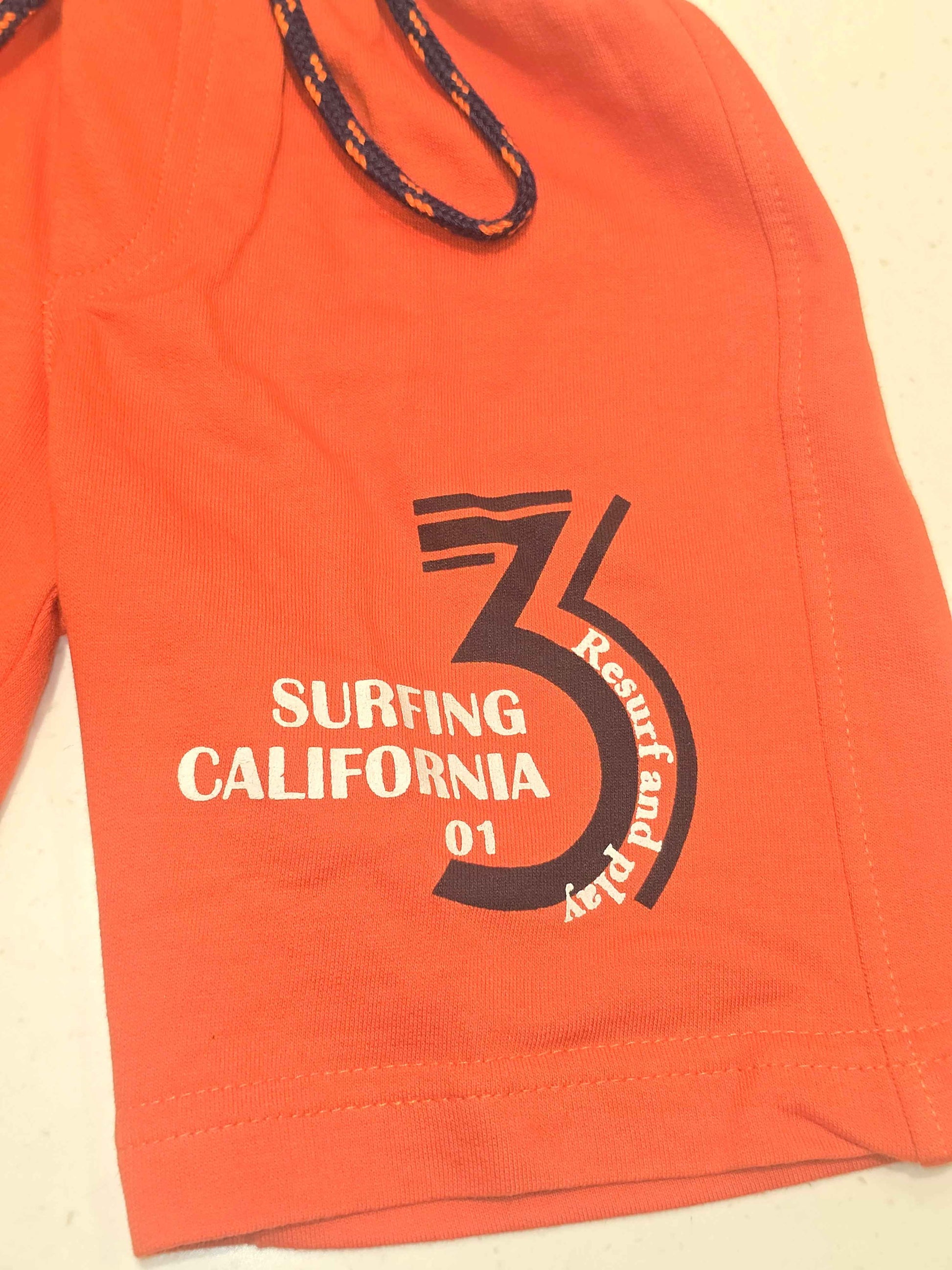 Pure cotton material orange coloured ¾ with prints and round Elasticable