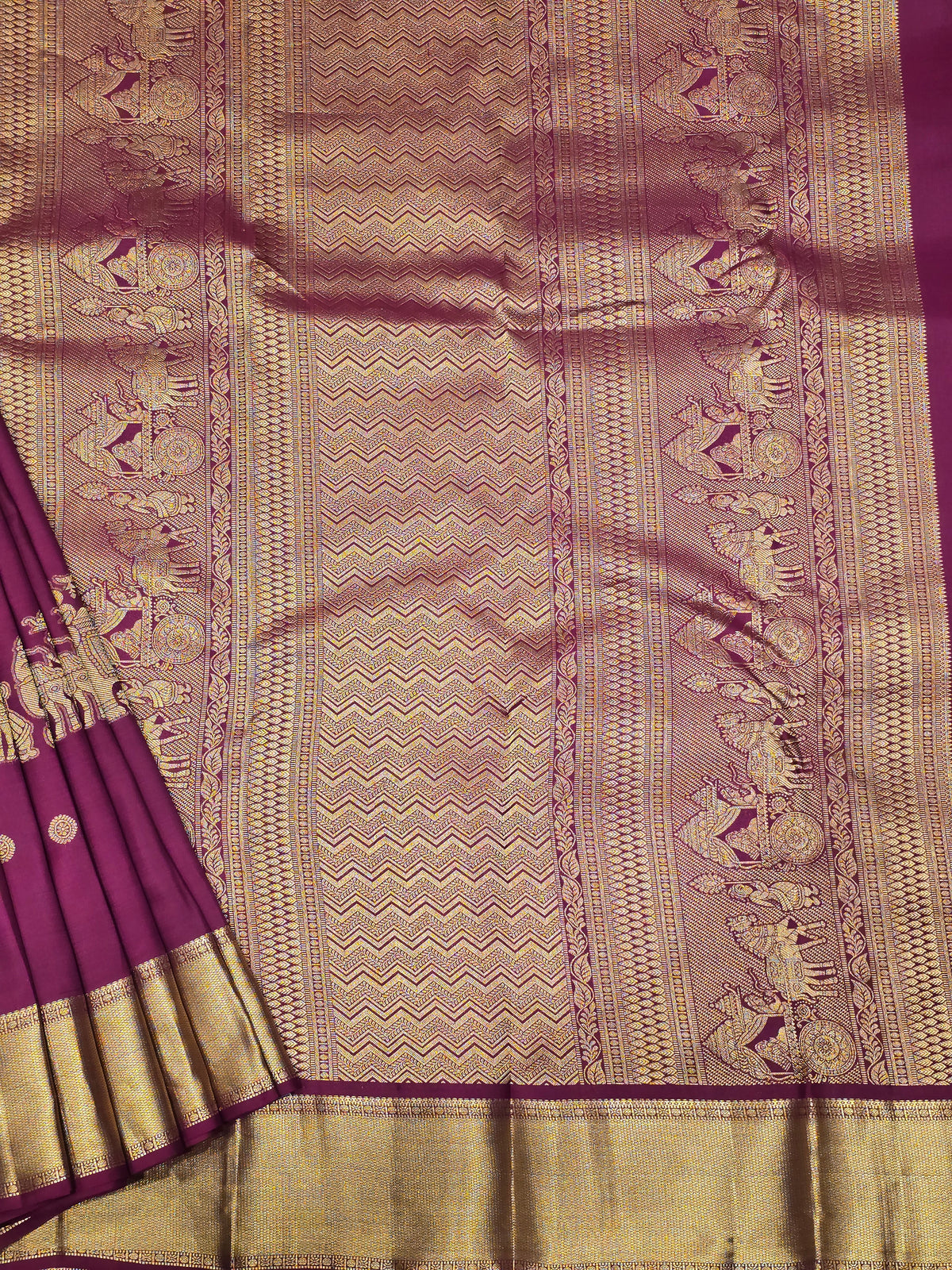 One saree is a deep royal purple, and the other is a rich magenta/wine tone.