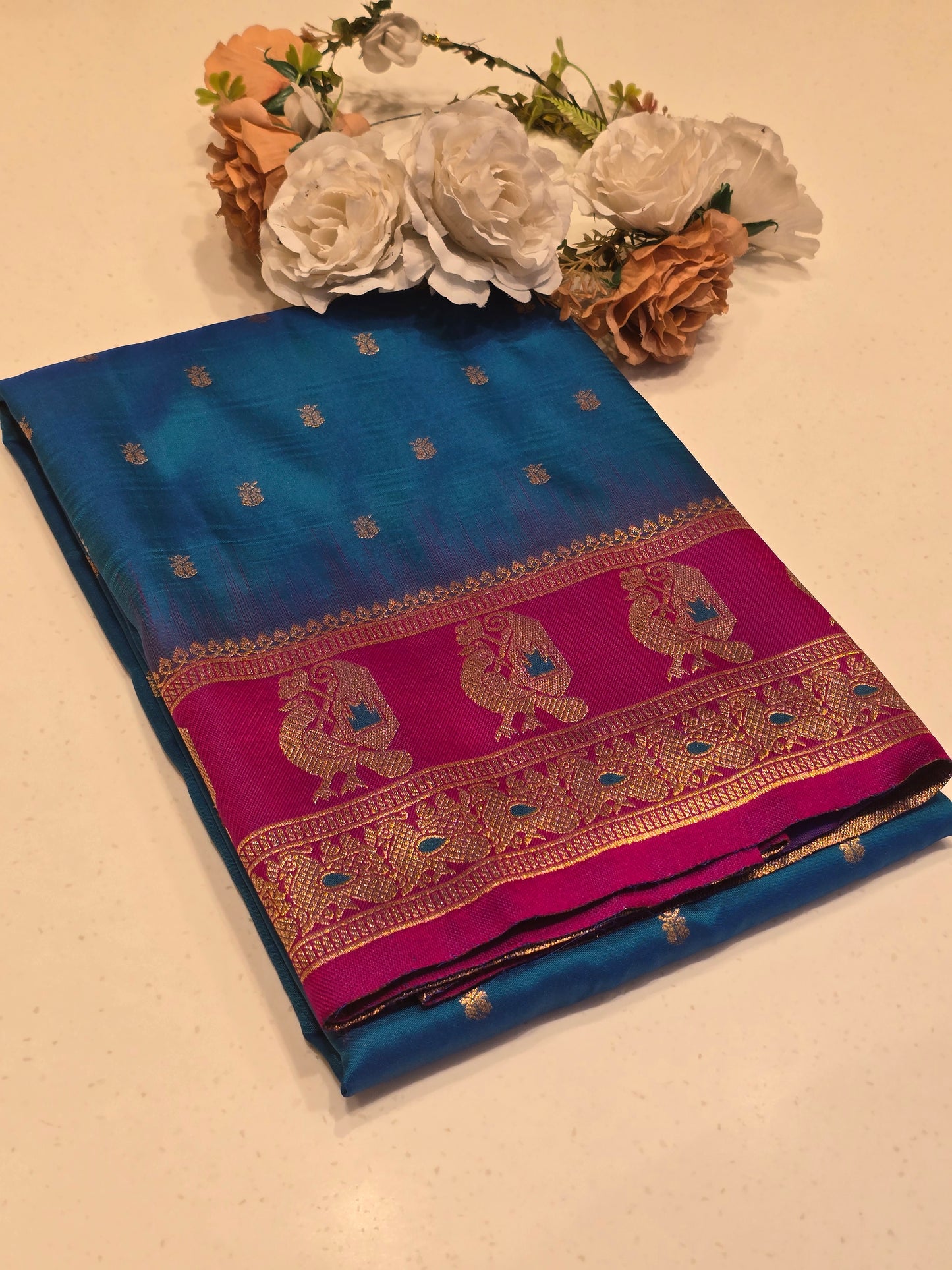 Semi soft silk with butta across the body rich pallu , traditional border