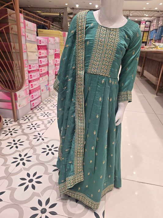 Rama green or teal-toned silk pleated Anarkali gown styled with an intricately embroidered bodice and a matching border dupatta.