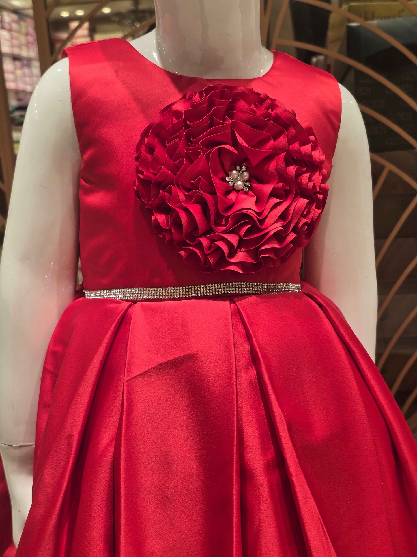 Satin material red colour baby frock with stone work belt on waist and floral cut work