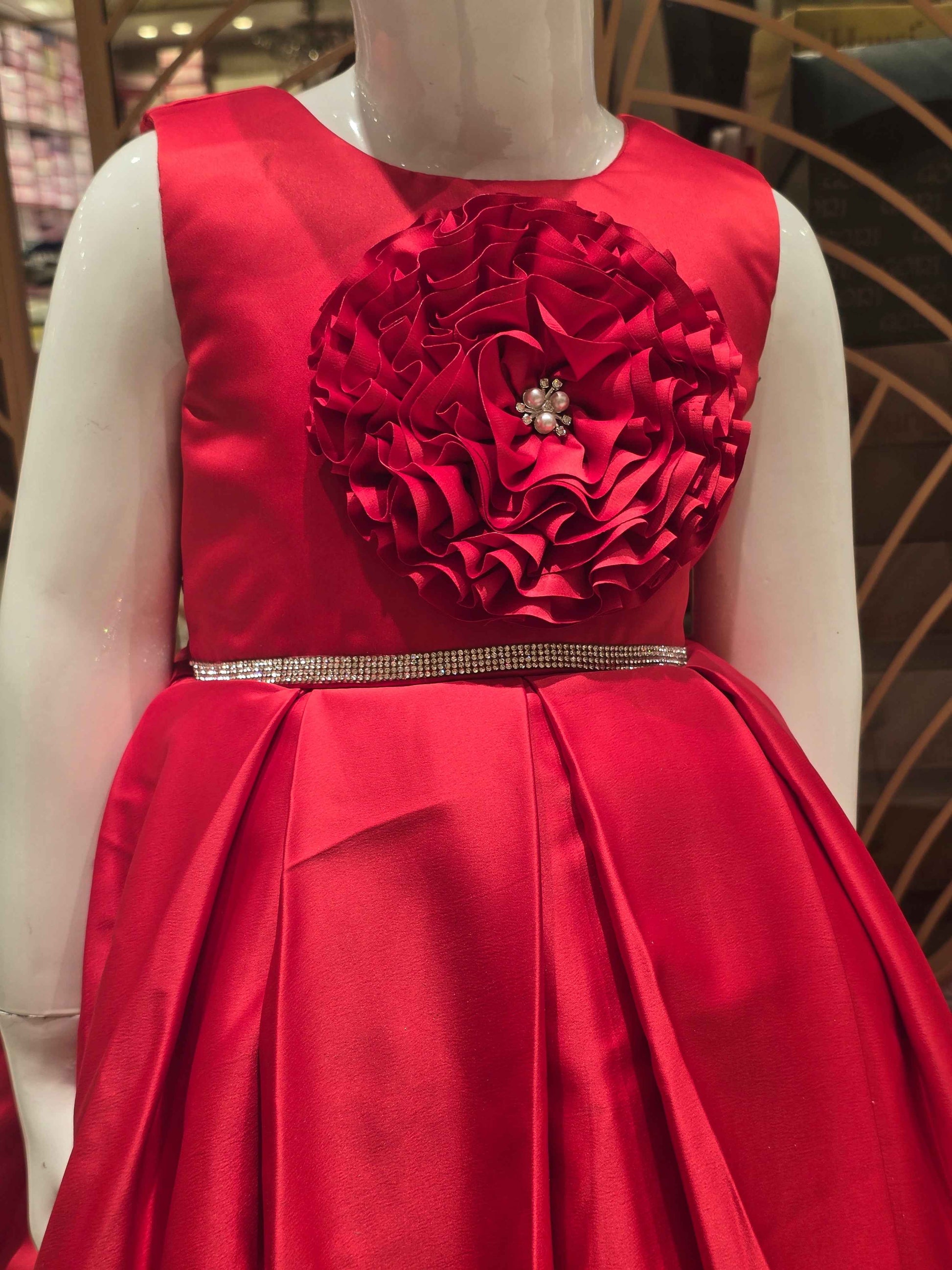 Satin material red colour baby frock with stone work belt on waist and floral cut work