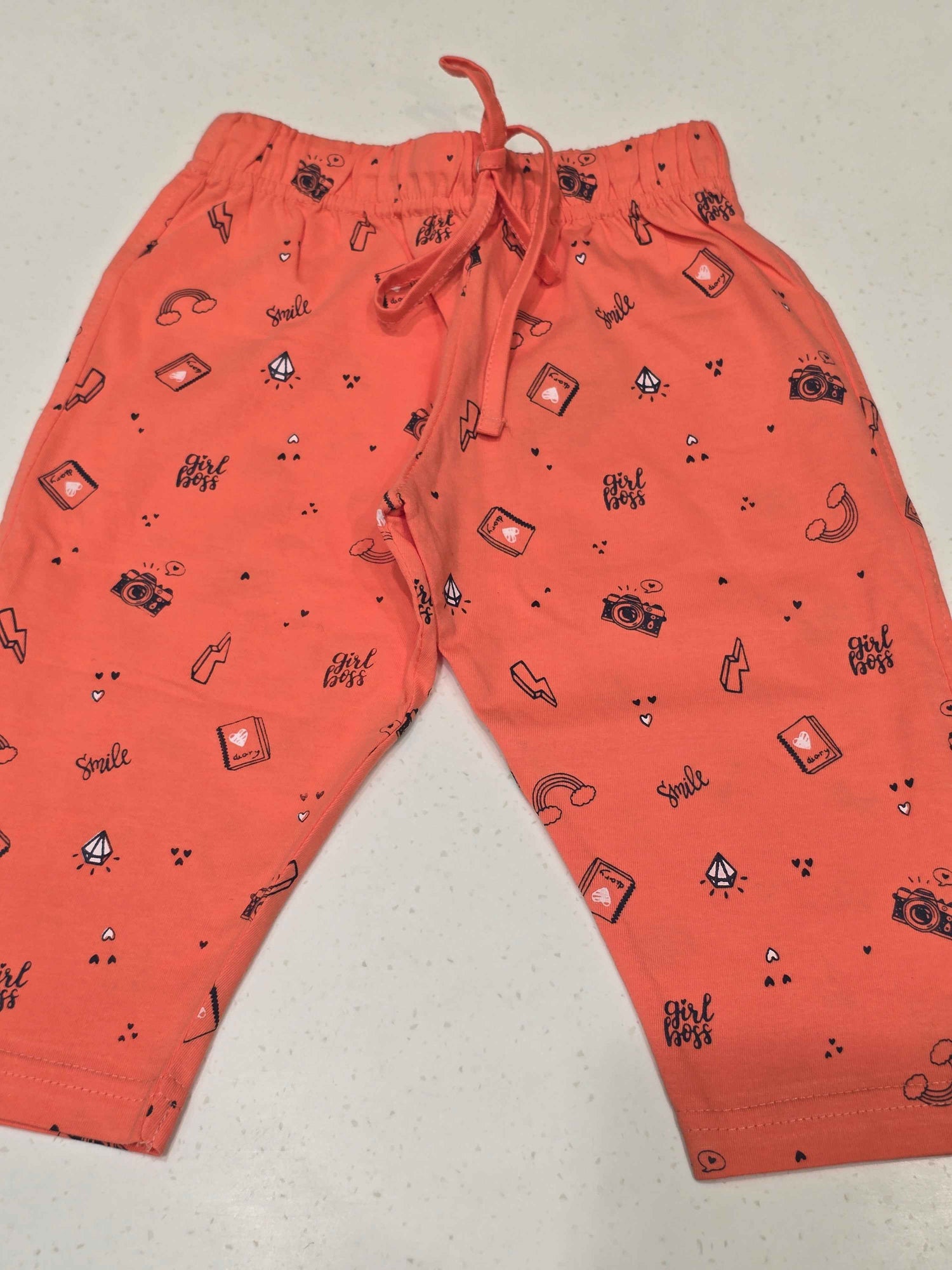 Printed Cotton material orange color capri for girls