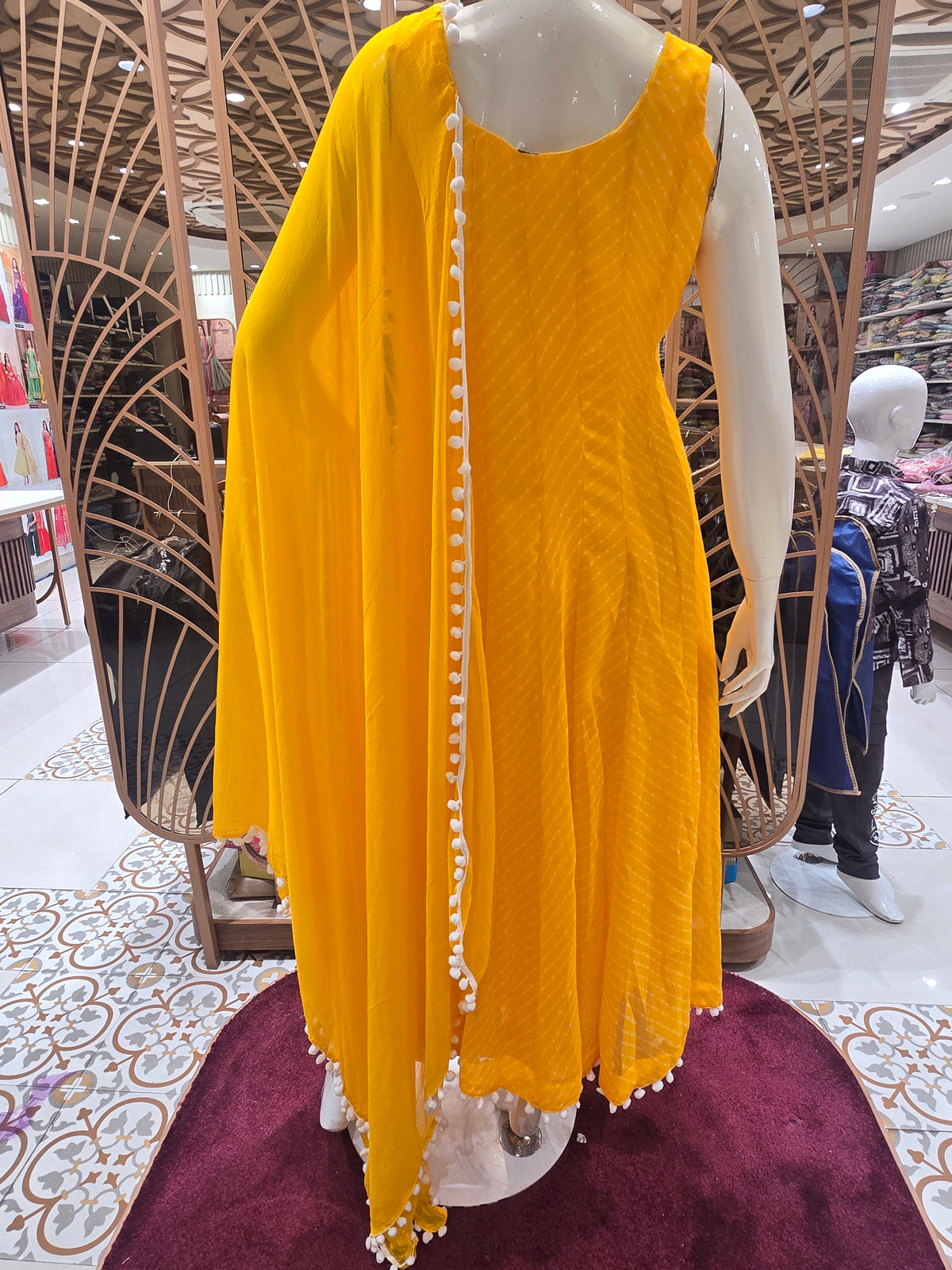 vibrant yellow Anarkali suit set.