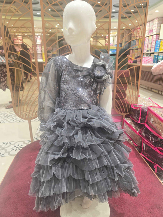 Knitted material grayish coloured short frock for baby girl with talecut pattren and sequence work over the top ,bow on left shoulder