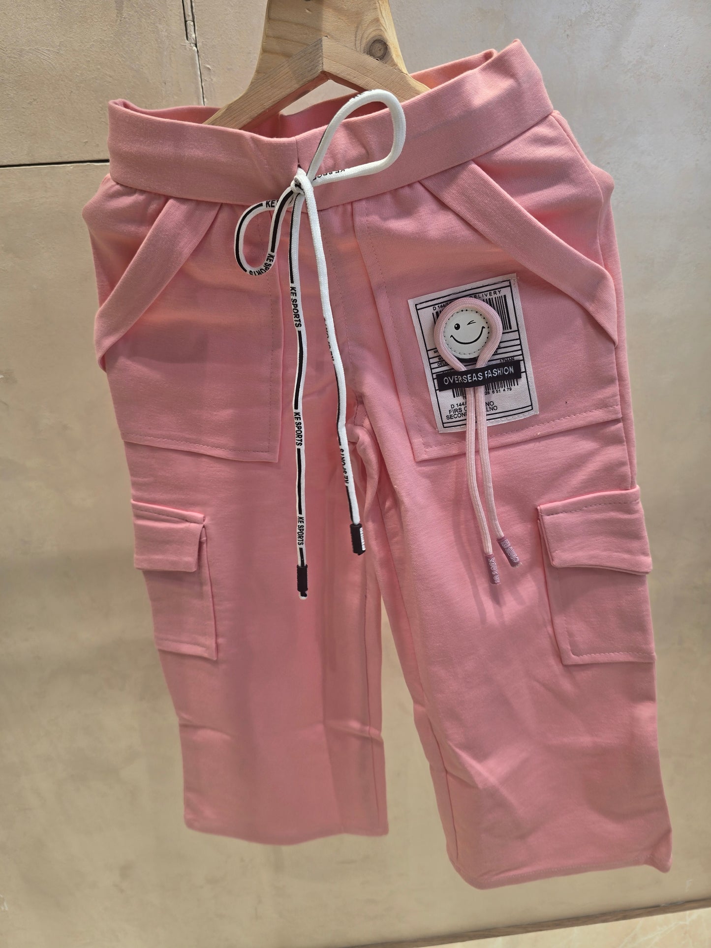 Baby Pink Cotton Cargo Pants with Smiley Logo & Six-Pocket Elastic Waist