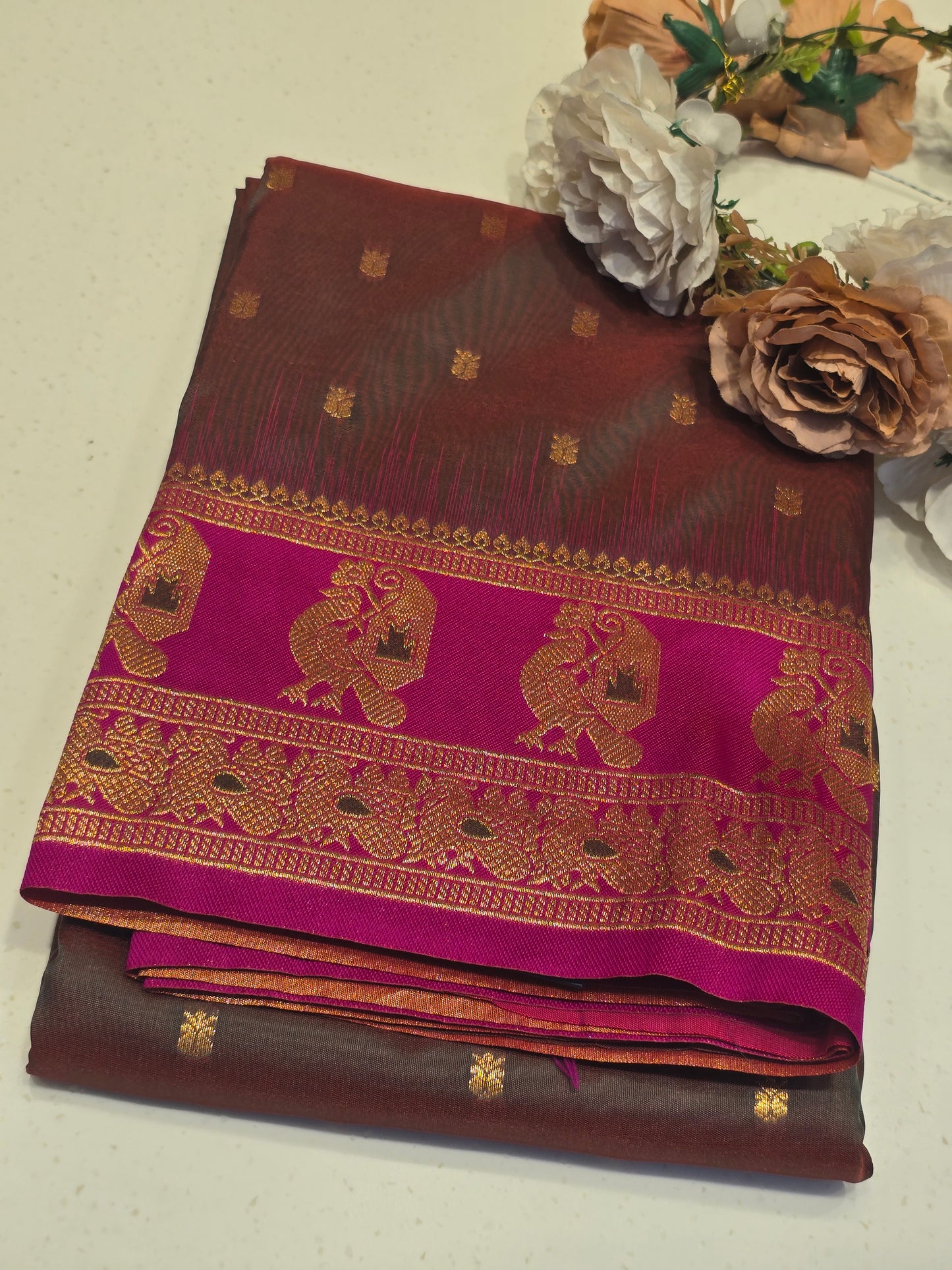 Semi soft silk with butta across the body rich pallu , traditional border