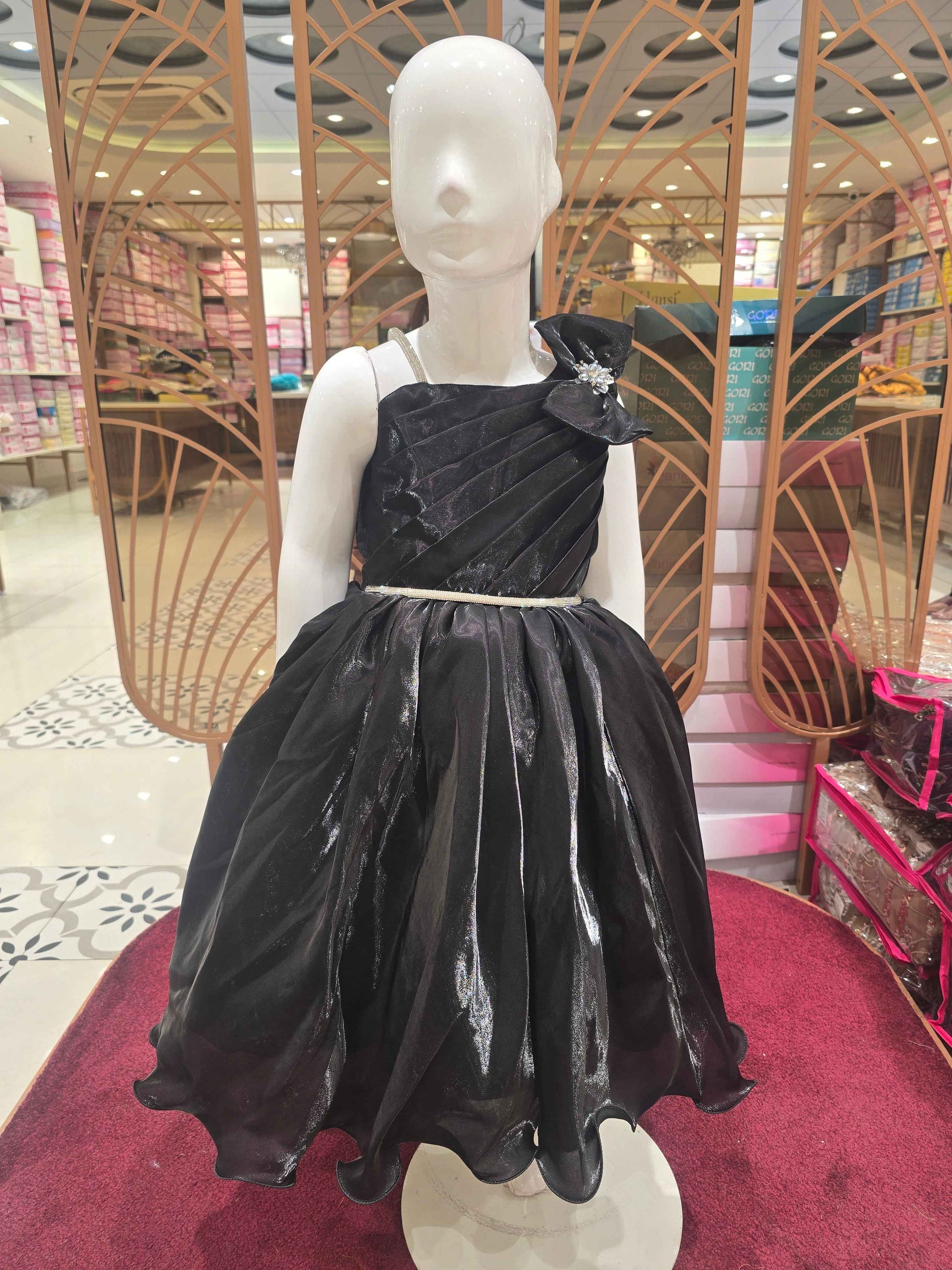 Satin material black coloured party wear frock with speghetti on right side and bow on left