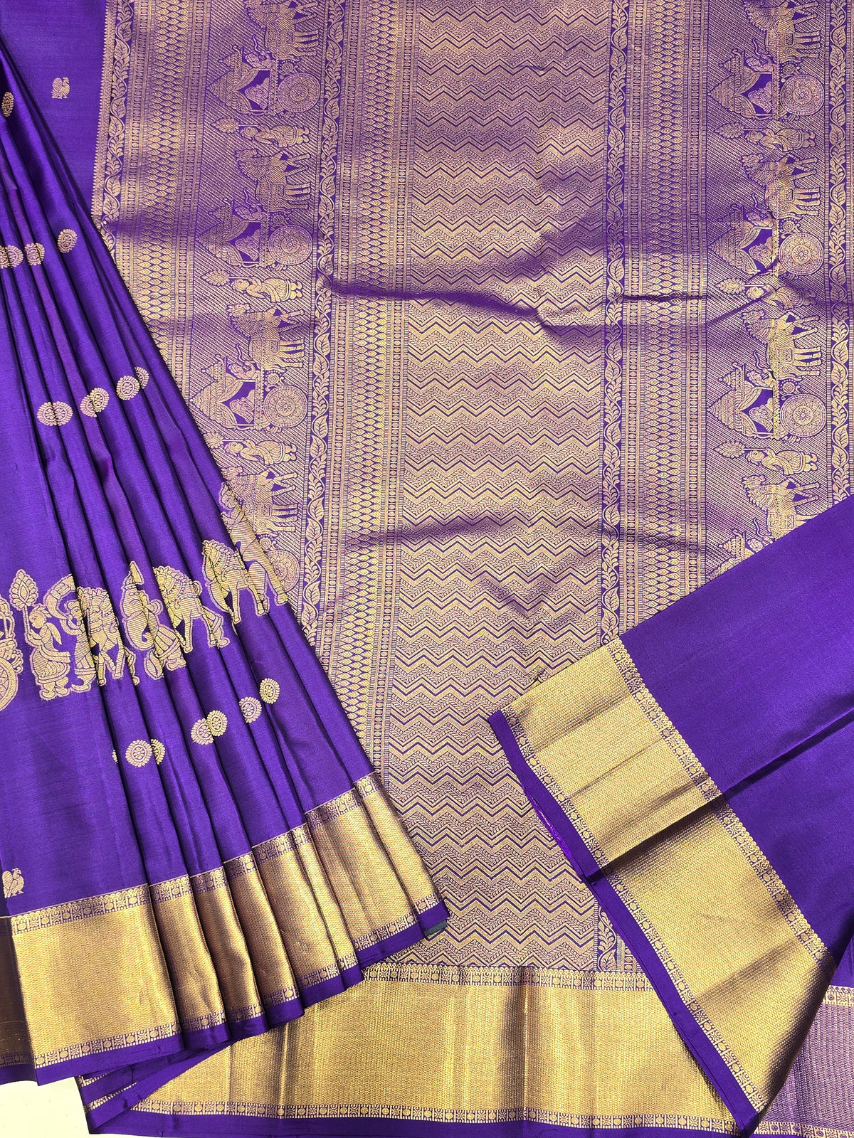 One saree is a deep royal purple, and the other is a rich magenta/wine tone.