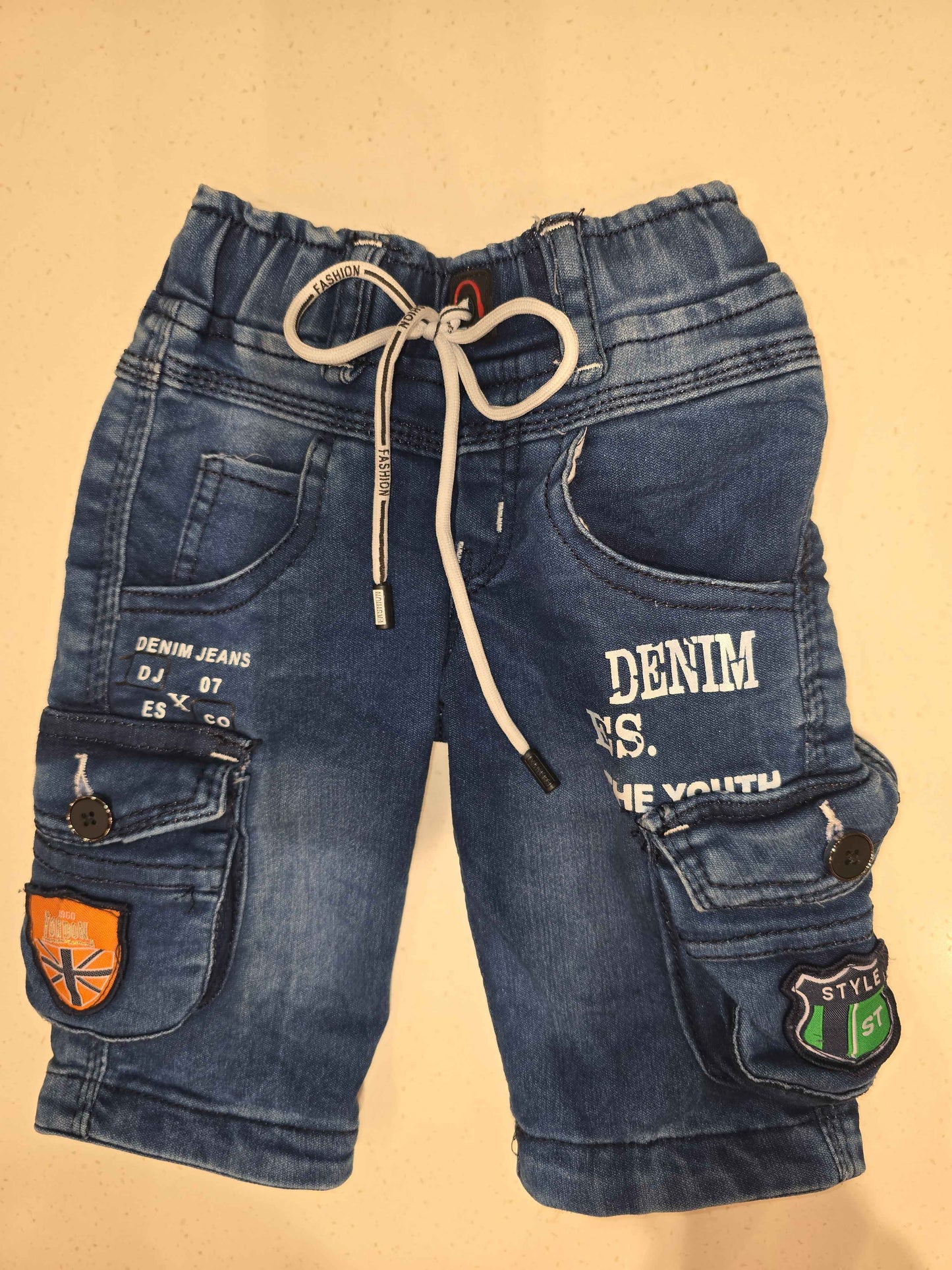 Denim material cargo shorts for boy with printed and round Elasticable with long tie