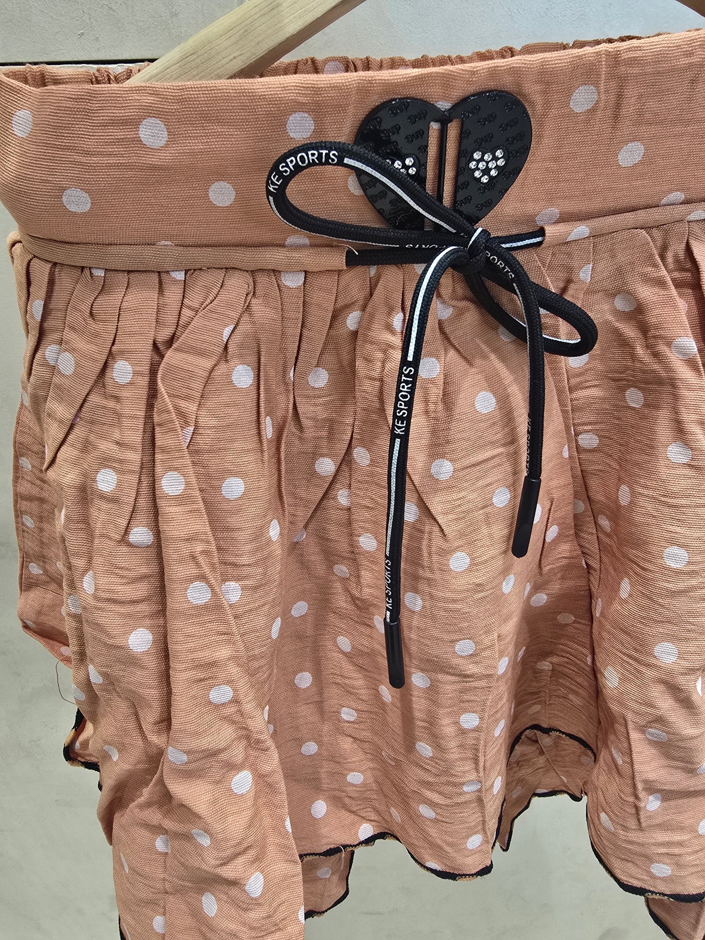 Girls Cotton Casual Wear Skirt in Peach with Polka Dot Design, Elastic Waist and Tie Detail for Summer Wear