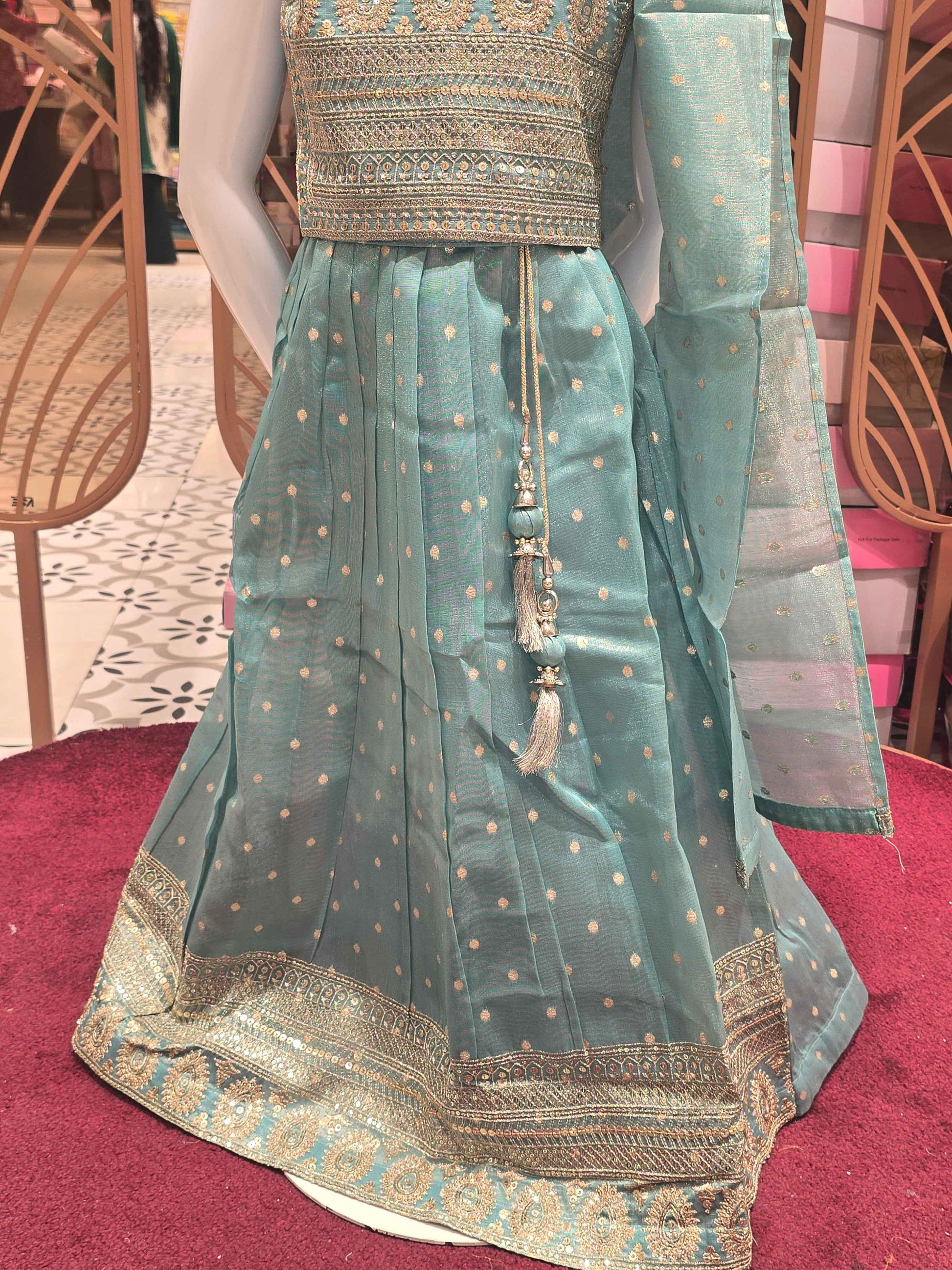 Organza material radium green colour ethnic wear gaghra choli with zari work and top & border. Small butta over the body