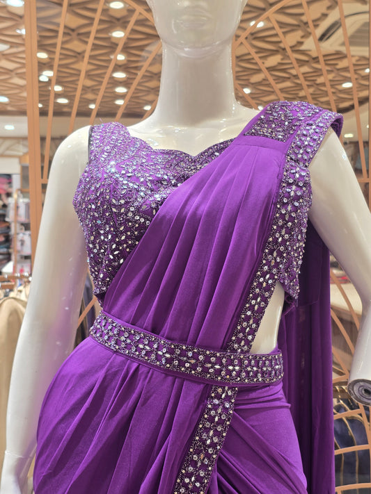 purple ready-to-wear pre-stitched saree crafted with a sleek, draping fabric like Lycra or satin crepe.