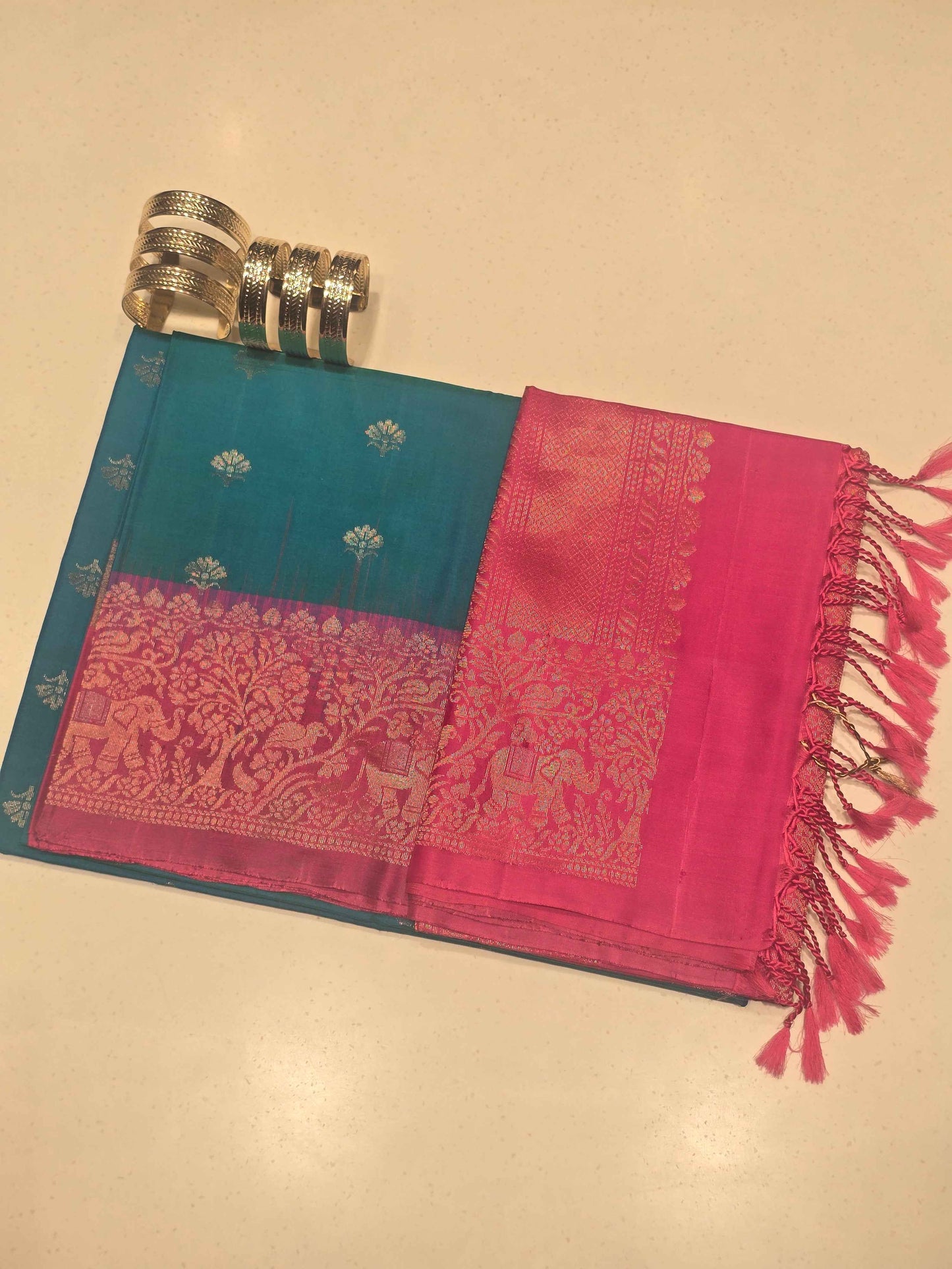 Pure softsilk peacock with pink colour saree and traditional border