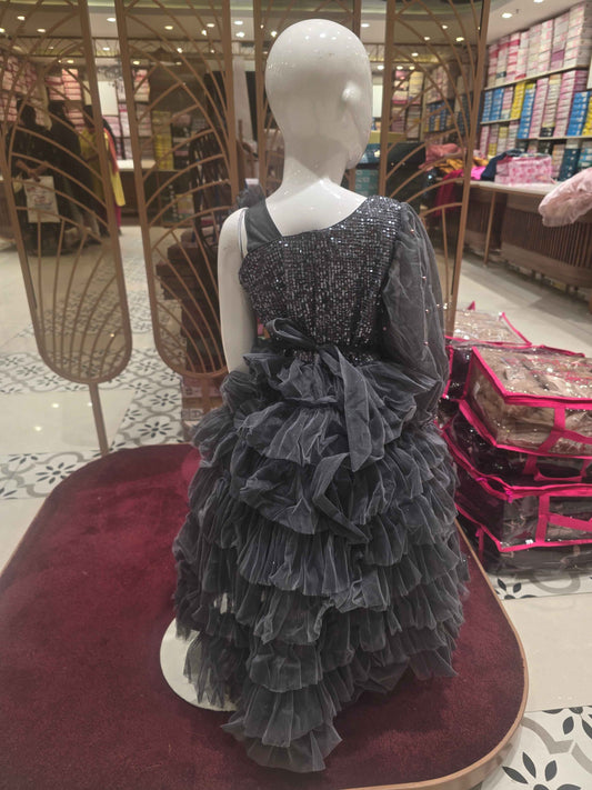 Knitted material grayish coloured short frock for baby girl with talecut pattren and sequence work over the top ,bow on left shoulder