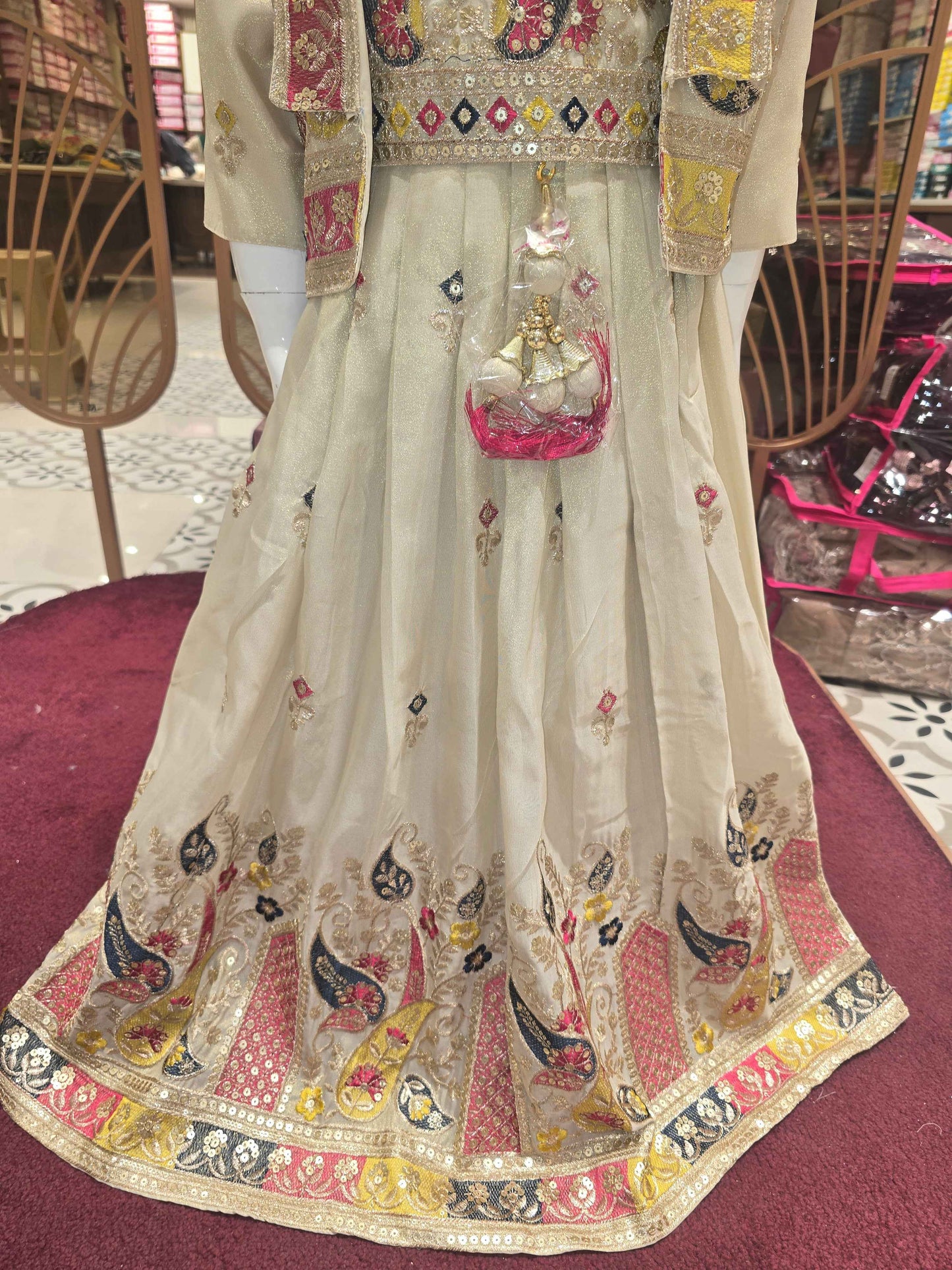 Shimmer material cream colour ethnic wear gaghra with multi colour embroidery, sequence & thread work with ladkans and jacket