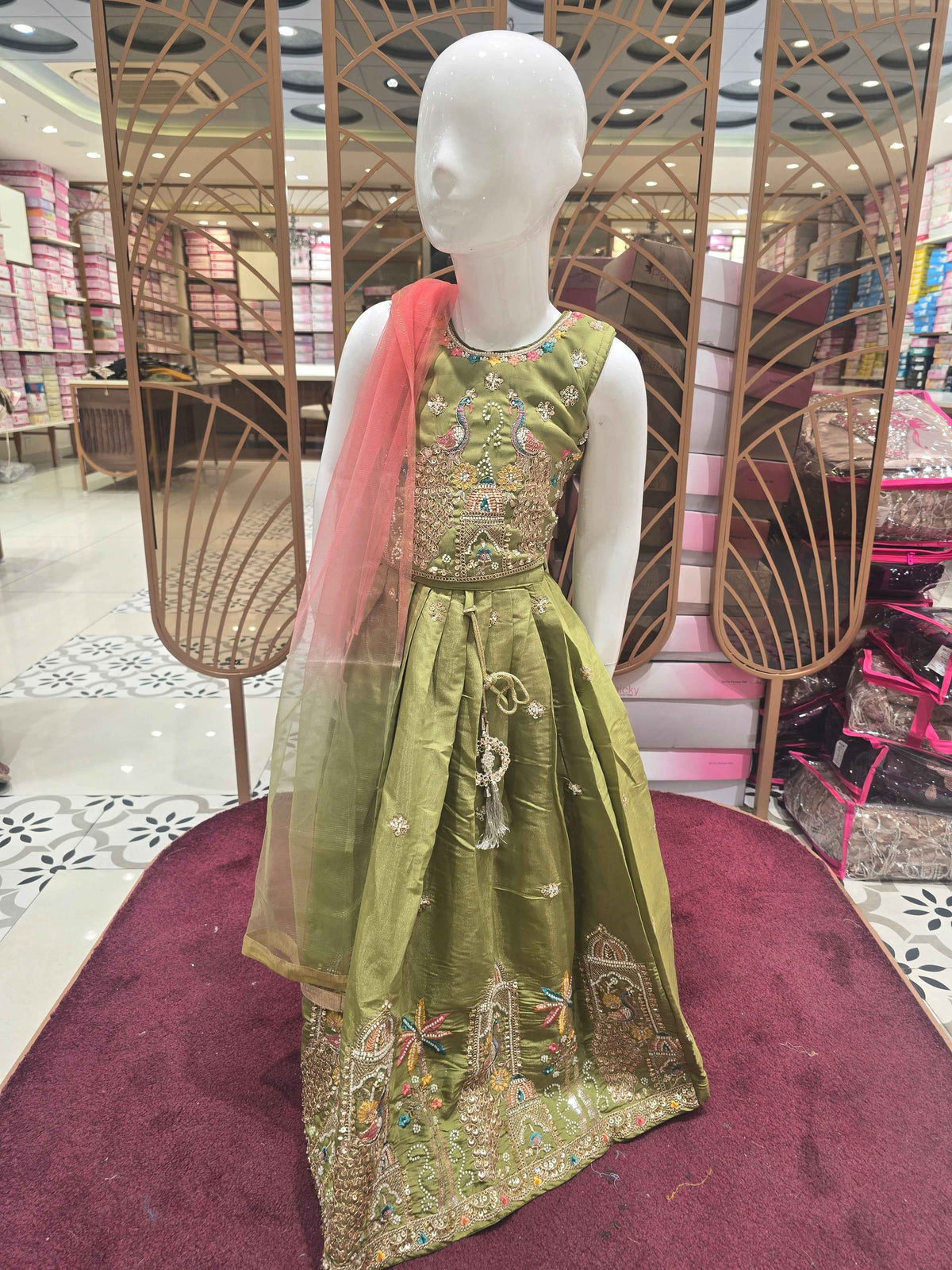 Chinon material yellow colour ethnic wear. beats & sequence work on peacock designed top and thread work on round neck, with ladkans