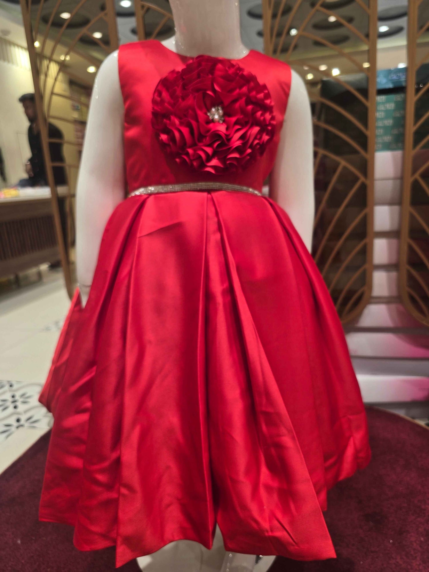 Satin material red colour baby frock with stone work belt on waist and floral cut work